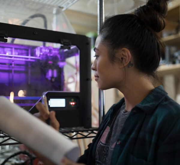 Apprentice working with 3D printer