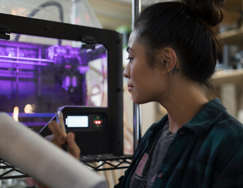 Apprentice working with 3D printer